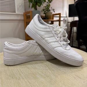 Adidas women’s bryony sneakers in cloud white with gold accents